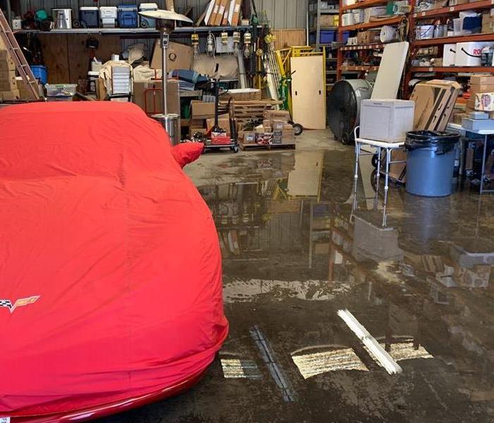 garage flood with car in red cover 