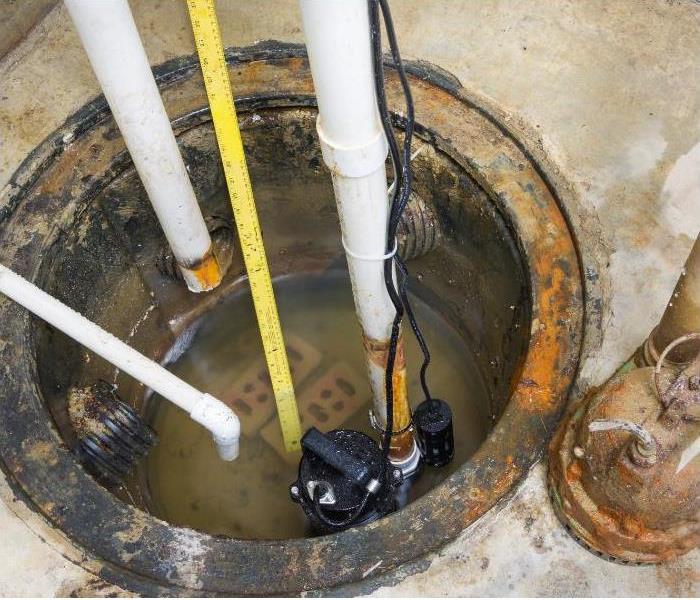 A sump pump with water inside 